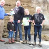 Looking forward to the 2022 silage season: Bio-Sil’s Frank Foster (left) with Loughgall dairy farmer Kieran McGeough. They were joined by Kieran’s four sons: Kieron (3), Bernard (7), Shay (11) and Cormac (10)
