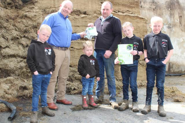 Looking forward to the 2022 silage season: Bio-Sil’s Frank Foster (left) with Loughgall dairy farmer Kieran McGeough. They were joined by Kieran’s four sons: Kieron (3), Bernard (7), Shay (11) and Cormac (10)
