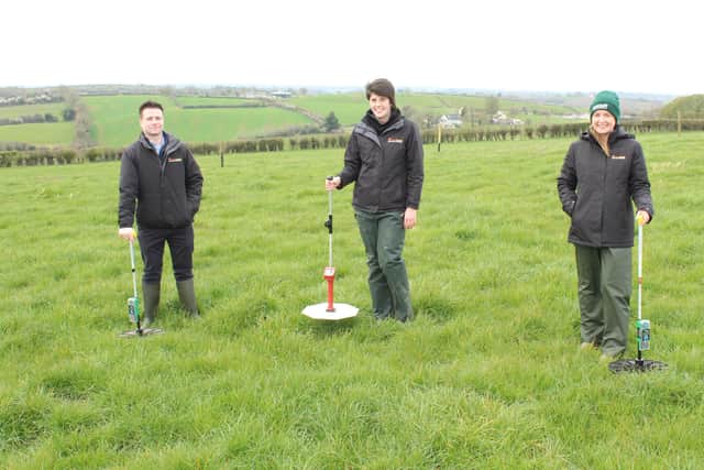 Andrew McMenamin, Kathryn McKeown, Edel Madden assessing grass cover with United Feeds plate meters