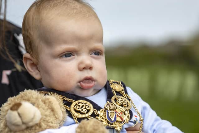 Albert McAuley, who was born on 6 February 2022, 70 years after HM The Queen’s accession, pictured with his Jubilee teddy bear while wearing the Mayor of Causeway Coast and Glens Borough Council’s chain of office.