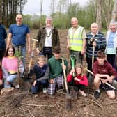 The Mayor of Causeway Coast and Glens Borough Council Councillor Richard Holmes pictured at Drumaheglis Holiday Park and Marina with volunteers who planted 300 new trees as part of The Queen’s Green Canopy. Also included is Council’s Holiday and Leisure Parks General Manager Steve McCartney (third from right).