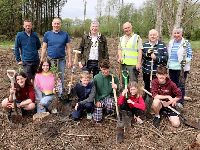 The Mayor of Causeway Coast and Glens Borough Council Councillor Richard Holmes pictured at Drumaheglis Holiday Park and Marina with volunteers who planted 300 new trees as part of The Queen’s Green Canopy. Also included is Council’s Holiday and Leisure Parks General Manager Steve McCartney (third from right).