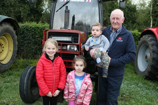 Robert McElroy brought his grandchildren to the tractor run at Annahinchago last Friday night -  Andrew, Karlee and Olivia Jane Bell