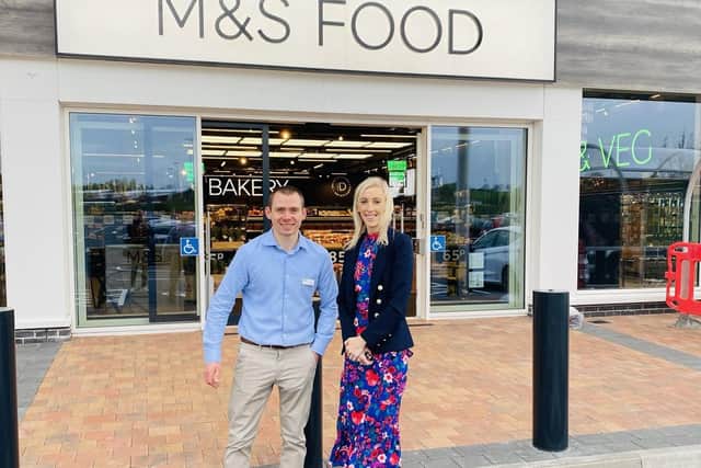 Carla Lockhart MP with the store manager Evan