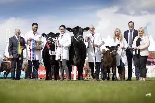 Aberdeen Angus championship presentation at 153rd Balmoral Show, pictured from left: judge Brian Clark, Ayrshire; Adam Armour and Cathy Holmes, with champion Woodvale Delia X867;  John Henning and Hannah Annett with reserve champion Drumcorn Lady Ida U492 and her heifer calf; Society CEO Robert Gilchrist; and a sponsor from Marks and Spencer. Picture: MacGregor Photography