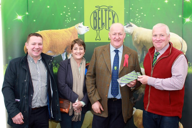 Irish Beltex Sheep Breeders Club chairman, Eddie O'Neill, makes a presentation of club colours to show judge, Kevin Buckle. Looking on are, Andy Ryder, Pedigree Livestock Services Limited and Jill Pattinson.