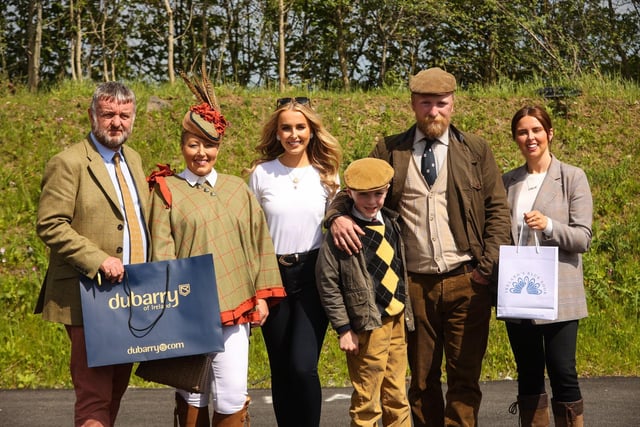 The Most Appropriately Dressed Lady and Gent at the 2022 Balmoral Show were won by Angela O’Rourke from Banbridge and father and son duo Brian and Henry Spencer from Hillsborough. Pictured (L-R) Paul Corson, Dubarry of Ireland, Angela O’Rourke, judge Cool FM’s Katharine Walker, Henry Spencer, Brian Spencer and Nicole Beatty, Ireland’s Blue Book.