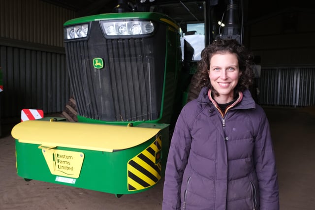 Contributor Anna Leadbetter in front of the John Deere 9RX tractor. Image: Raw Cut Television