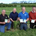 Inspecting grass that was cut on Wednesday of this week (left to right) Adrian Jamison, Lavin, Dunloy, Co Antrim; Frank Foster, Bio-Sil; David Jamison and Richard Owens, Owens’ Farm Solutions.