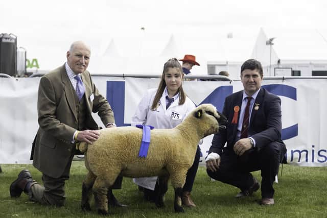 LMC board member Joe Stewart pictured with Lucy Wells sheep young handler reserve champion in the 12-14 age group. Also pictured is judge, Michael Graham