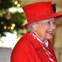 WINDSOR, ENGLAND - DECEMBER 08: Queen Elizabeth II thanks local volunteers and key workers for the work they are doing during the coronavirus pandemic and over Christmas in the quadrangle of Windsor Castle on December 8, 2020 in Windsor, England.  The Queen and members of the royal family gave thanks to local volunteers and key workers for their work in helping others during the coronavirus pandemic and over Christmas at Windsor Castle in what was also the final stop for the Duke and Duchess of Cambridge on their tour of England, Wales and Scotland. (Photo by Glyn Kirk - WPA Pool/Getty Images)
