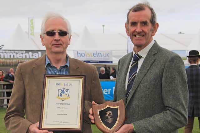 William Hunter, Lisnacloon Herd, Castlederg, is pictured receiving his Master Breeder Award at Balmoral Show from John Jamieson, President, Holstein UK. Picture: Julie Hazelton
