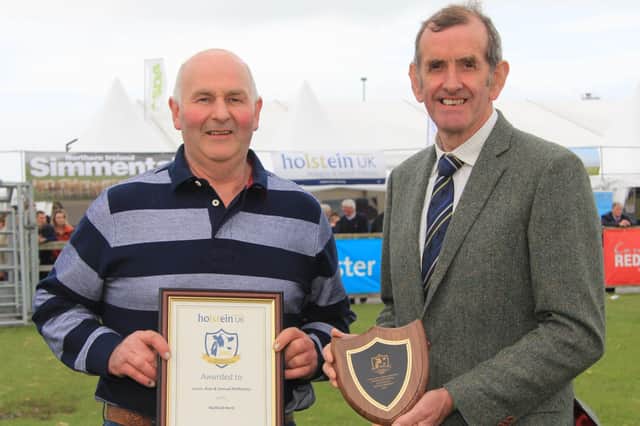 Alan McMurray, Matfield Herd, Banbridge, receives the Master Breeder Award from Holstein UK President John Jamieson. Picture: Julie Hazelton