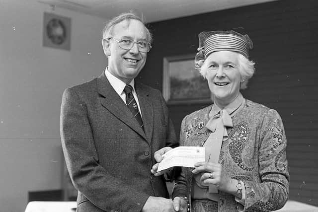 Cheques for Riding for the Disabled Association in May 1982, Mrs Angela Wilson, Ballymena, chairman of the Northern Ireland region of the association, receiving from RUAS president, Mr Alan Anderson, a cheque for £1,200, proceeds of show cheese and butter auctions. Picture: Farming Life/News Letter archives