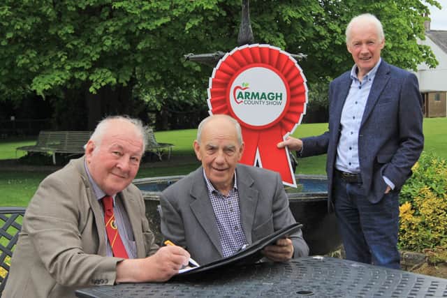 Discussing entries for the National Simmental Show are, George McCall, centre, chairman Armagh County Show, with NI Simmental Cub committee members David Hazelton and Leslie Weatherup. Picture: Julie Hazelton