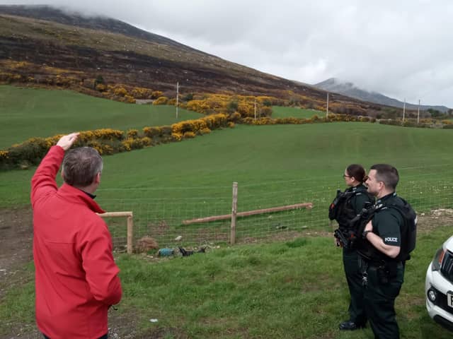 Department of Agriculture, Environment and Rural Affairs (DAERA) officials and staff from the PSNI and NIFRS assess the damage caused by recent wildfires across the Mournes.