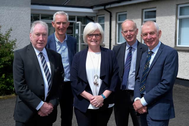 Sam Campbell, CEO, AI Services, left and Robin Irvine, Chairman,
right, pictured with newly co-opted Directors at the AI Services AGM.
Included are, from left: Gerard Rainey, Oonagh Chesney and Sinclair
Mayne.
