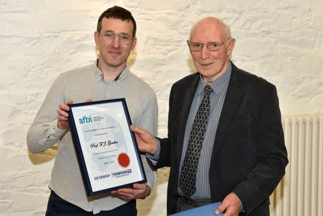 Dr Ramon Muns (Head of the AFBI Monogastric Research Group) presenting a commemorative certificate to Professor Fred Gordon.