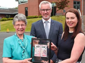 Terry Robb and Sandra Wright, right, of Ulster Bank presented Dame Jocelyn Bell Burnell, left, with the first of the new £50 notes available in Northern Ireland.