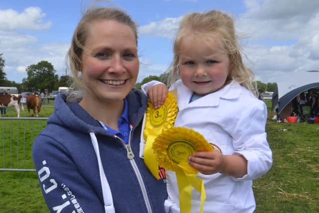 Kim Montgomery whose daughter Amelia shows off her two rosettes.
