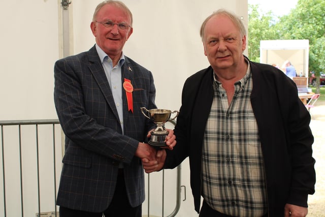 Gordon Walker receiving his show champion award in the poultry section at Saintfield.