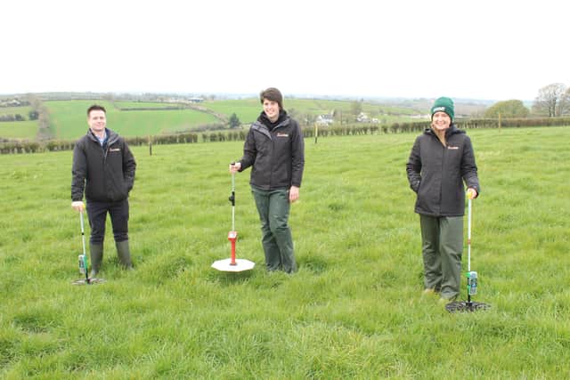 Andrew McMenamin, Kathryn McKeown and Edel Madden assessing grass cover with United Feeds plate meters