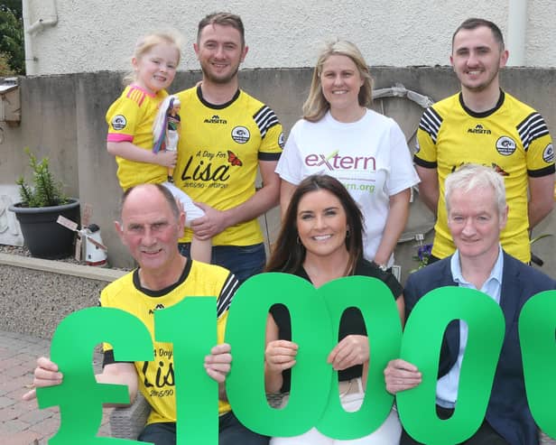 The family of Cushendall woman Lisa McAlister are donating £10,000 in her memory to local mental health charity Extern. (Back row, from left) Ríah and Mark McAlister, Extern Fundraising Manger Grace O’Neill, Ryan McAlister. (Front row, from left) Dominic McAlister, Extern Project Manager Sharon Smith, Extern Interim Director of Services NI Billy Murphy. Picture by Kevin McAuley/McAuley Multimedia.