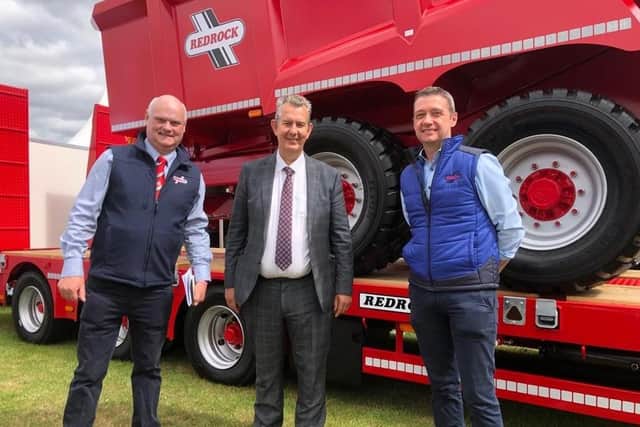 DAERA Minister Edwin Poots is pictured at the Royal Highland Show with Frank Flynn and James Rooney from Redrock Machinery who produce agricultural machinery in Armagh.
