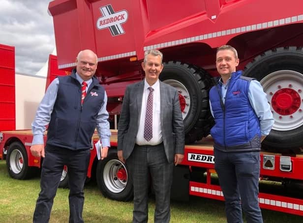 DAERA Minister Edwin Poots is pictured at the Royal Highland Show with Frank Flynn and James Rooney from Redrock Machinery who produce agricultural machinery in Armagh.