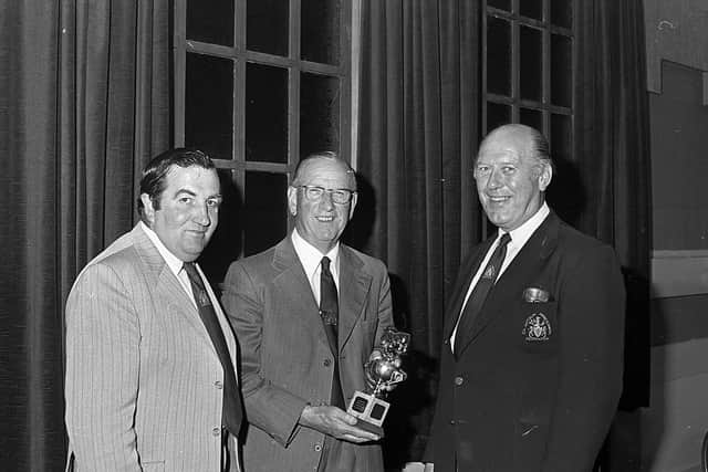 Admiring the Ivomac Trophy for the Ballymena Show, during the launch of the 1982 show in June 1982, are Mr Brian King, Mr Harry McKinney, vice chairman, and Mr Robert Orr, chairman. Picture: Farming Life/News Letter archives