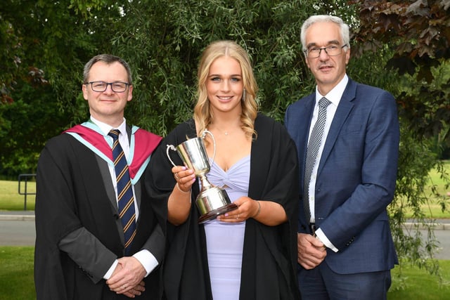 Lucy Watt (Dungannon) was awarded with the Department of Agriculture, Environment and Rural Affairs Prize for achieving the highest marks in all subjects on the National Diploma in Food, Nutrition and Health course. Congratulating Lucy at the Loughry Campus Graduation Ceremony are Shane McKinney (Head of Food Technology Education, CAFRE) and Norman Fulton (Deputy Secretary, DAERA).