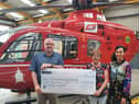 Johnston and Alison Gilmore presenting Kerry Anderson from Air Ambulance NI charity with a cheque for £6,200 from their Bluebell and Birdsong fundraiser.