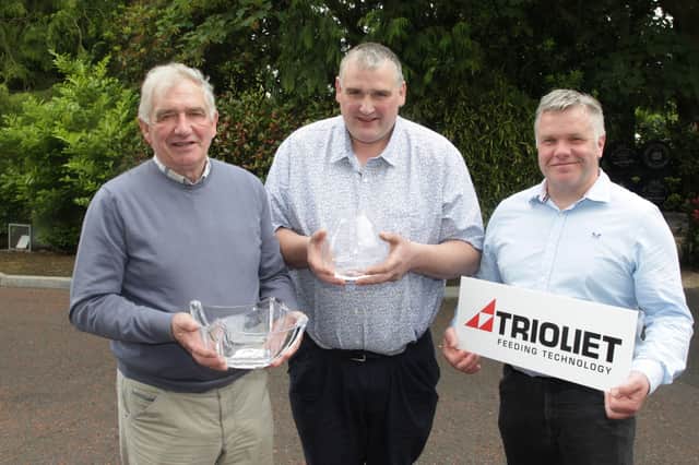 William and James Crawford, Ardmore, Brookeborough, won the awards for the best heifer and best senior cow in the senior section of the herds inspection competition. Adding his congratulations is Holstein NI chairman. Alex Walker. The senior section was sponsored by Trioliet. Picture: McAuley Multimedia