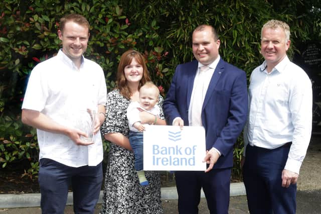 Andrew, Jen and baby Jesse McLean, Relough, won the premier section awards for the best 70T cow and best cow family. Adding their congratulations are sponsor Richard Prirmrose, Bank of Ireland; and Welsh judge Wyn Jones. Picture: McAuley Multimedia