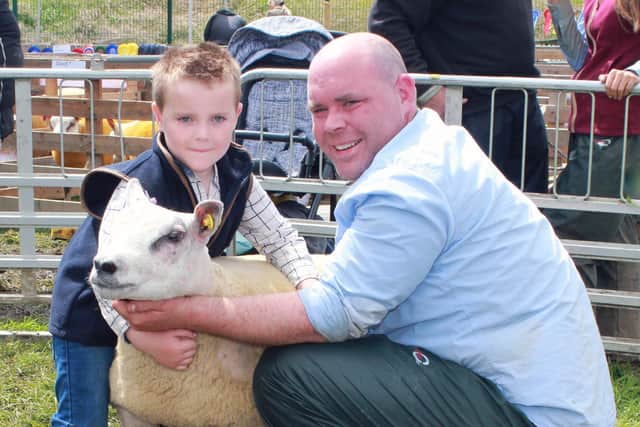 Joint first in the pre-school Young Handlers class is Harry Scott from Omagh pictured with his father, Gary.