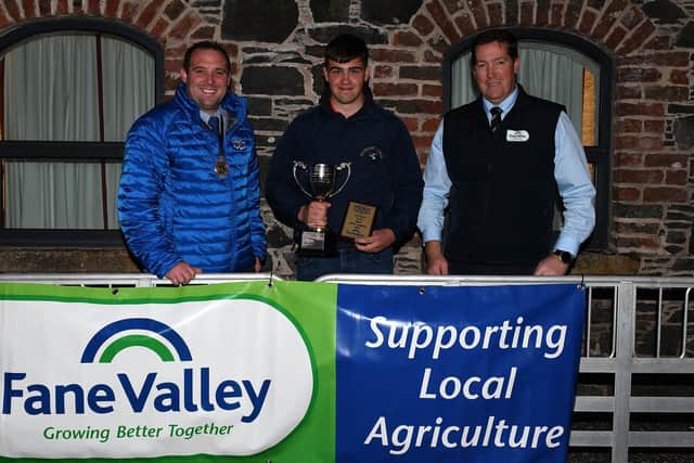 YFCU President Peter Alexander, with  James Morrison, Lisbellaw YFC who placed 1st in the Beef Stock Judging 16-18 age category, along with Thomas Barnet, Fane Valley Stores.