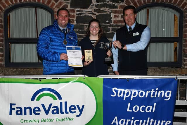 YFCU President Peter Alexander, with  Jane Patton, Newtownards YFC who placed 1st in the Beef Stock Judging 25-30 age category, along side Thomas Barnet, Fane Valley Stores.