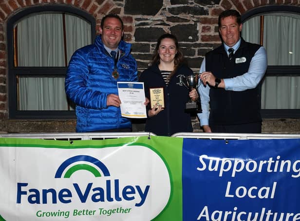 YFCU President Peter Alexander, with  Jane Patton, Newtownards YFC who placed 1st in the Beef Stock Judging 25-30 age category, along side Thomas Barnet, Fane Valley Stores.
