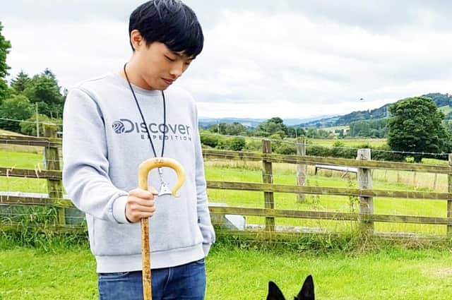 South Korea’s Jaehoon Lee is pictured with one of his working sheep dogs previously bought and imported from the UK.