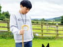 South Korea’s Jaehoon Lee is pictured with one of his working sheep dogs previously bought and imported from the UK.