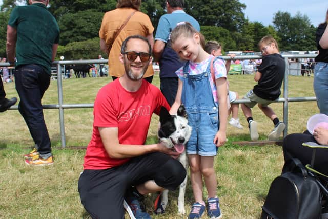 Peter McEvoy and his daughter Lily, from Annaclone in Co Down,
enjoying the sights and sounds of Castlewellan Show with their one
year-old collie 'Lucky'