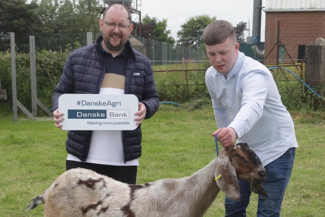 Pedigree Milker Champion goat with Chris McGuiness, and Paul Clingan from Danske Bank, pictured at Limavady Show on Saturday. Picture: Kevin McAuley/McAuley Multimedia