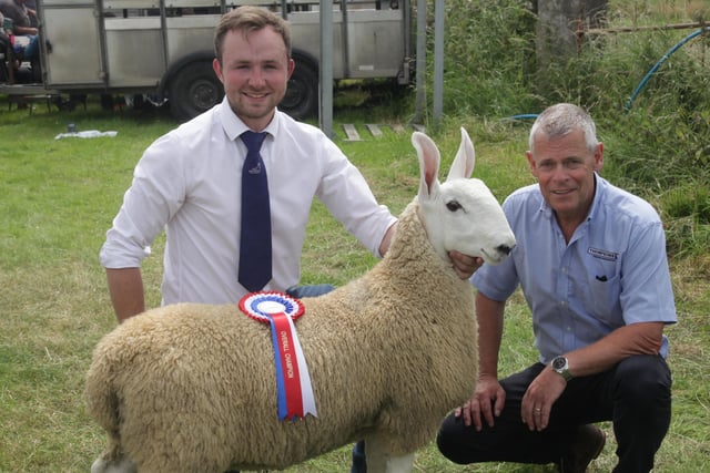 William Semple, Gortnagross, with his prizewinner ram lamb, and Kenny Coulter from Thompsons pictured at  Limavady Show on Saturday. Picture: Kevin McAuley/McAuley Multimedia