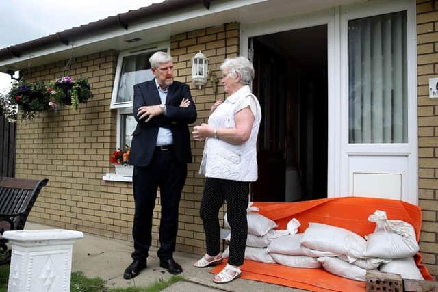 Infrastructure Minister John O’Dowd meeting a resident in Eglinton.