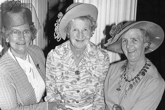 The Dowager Duchess of Abercorn, who was the president of the Federation of Women’s Institutes of Northern Ireland, centre, cuts the cake at the Golden Jubilee luncheon at Belfast City Hall at the end of June 1982. Included are Mrs Ida McLaren, vice chairman of the new executive from Beragh WI, Co Tyrone, left, and Mrs Patricia Ringland, chairman of the federation. Picture: News Letter archives
