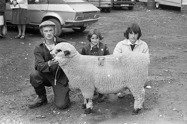 Mr John Killen from Maguiresbridge, Co Fermanagh, with the Hampshire Down champion ram, which was also supreme overall, with Lucy and Claire at the Enniskillen (Fermanagh) Show in August 1982. Picture: Farming Life/News Letter archives