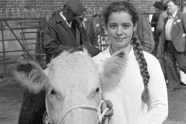 Margaret McQuilkin from Carrickfergus, Co Antrim, with the first prize winning Hereford heifer which was showing for Mr J Barron at the Enniskillen (Fermanagh) Show in August 1982. Picture: Farming Life/News Letter archives