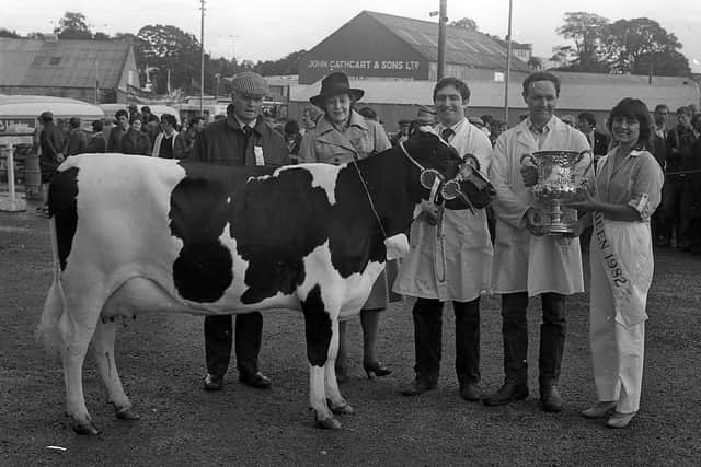 The Crawford brothers, Willian and Herbie of Rathkeelan, Maguiresbridge, won the supreme All-Ireland dairy cow championship, for the third successive year, at the Enniskillen (Fermanagh) Show in August 1982. On the right, Herbie is pictured receiving the coveted trophy from Miss Elizabeth Nassar from Nazareth, Israel, the show queen for 1982, and on the left are the Scottish judge, Mr R Templelton from Kilmarnock, and the Dowager Duchess of Westminster, president of the Co Fermanagh Farming Society. The Crawfords also won other cattle championships, including the Shorthorn and Limousin sections. Picture: Farming Life/News Letter archives