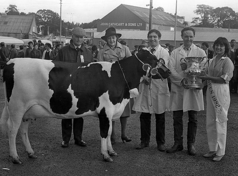 The Crawford brothers, Willian and Herbie of Rathkeelan, Maguiresbridge, won the supreme All-Ireland dairy cow championship, for the third successive year, at the Enniskillen (Fermanagh) Show in August 1982. On the right, Herbie is pictured receiving the coveted trophy from Miss Elizabeth Nassar from Nazareth, Israel, the show queen for 1982, and on the left are the Scottish judge, Mr R Templelton from Kilmarnock, and the Dowager Duchess of Westminster, president of the Co Fermanagh Farming Society. The Crawfords also won other cattle championships, including the Shorthorn and Limousin sections. Picture: Farming Life/News Letter archives