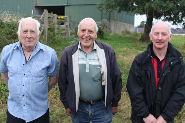 Watching the tractor run at Magherally (from left) Brian Snowden, John Bingham and Brian Hilland